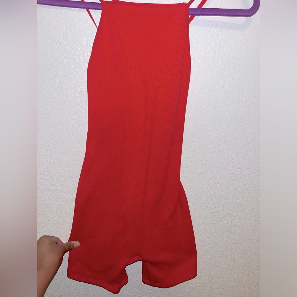 New, has a little rip on the arm strap